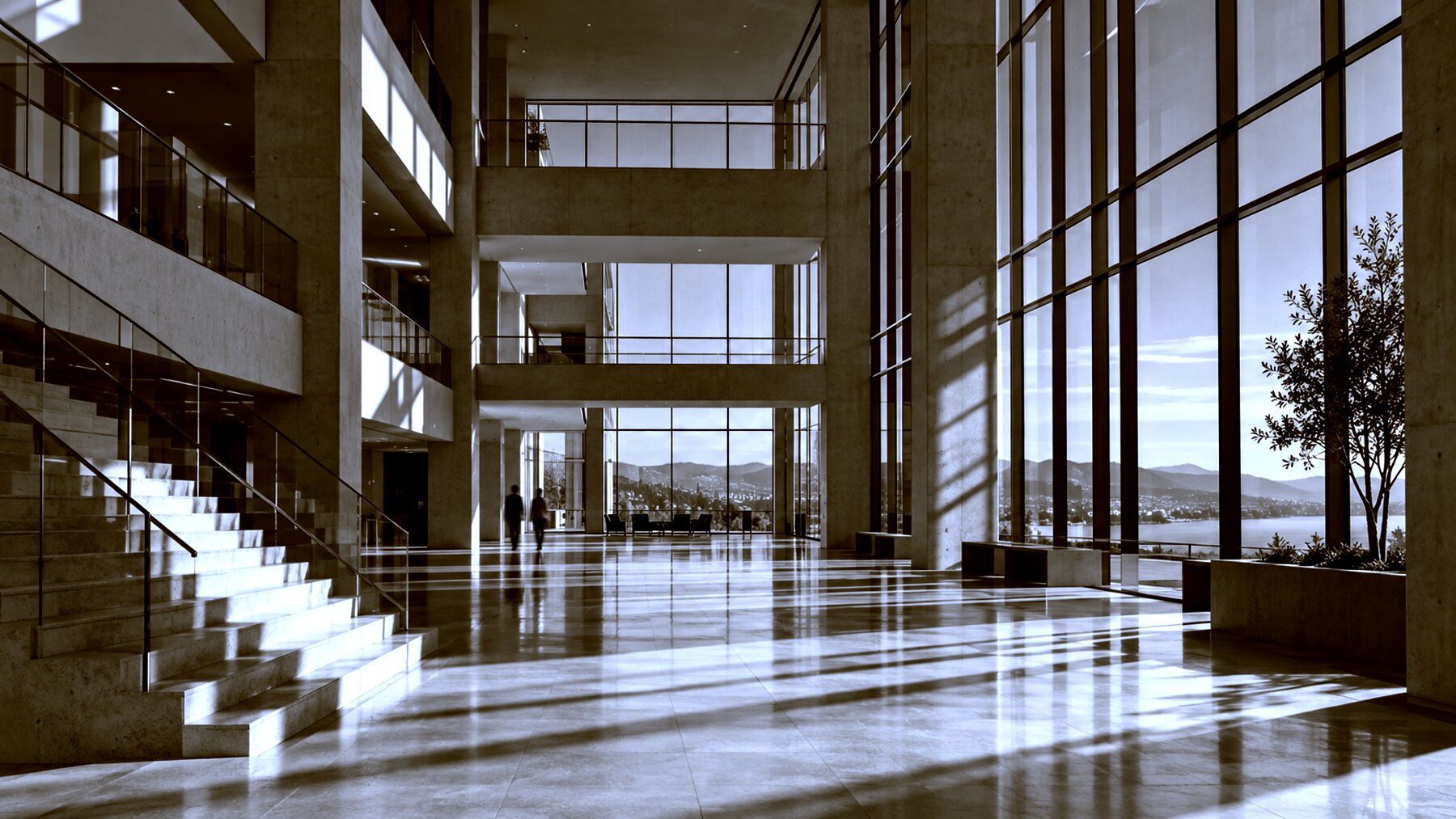 A bright office atrium in concrete and glass